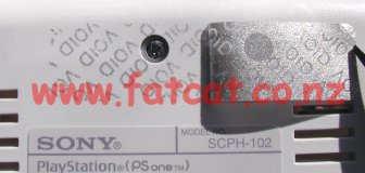 Close-up warranty seal removal and hidden screw